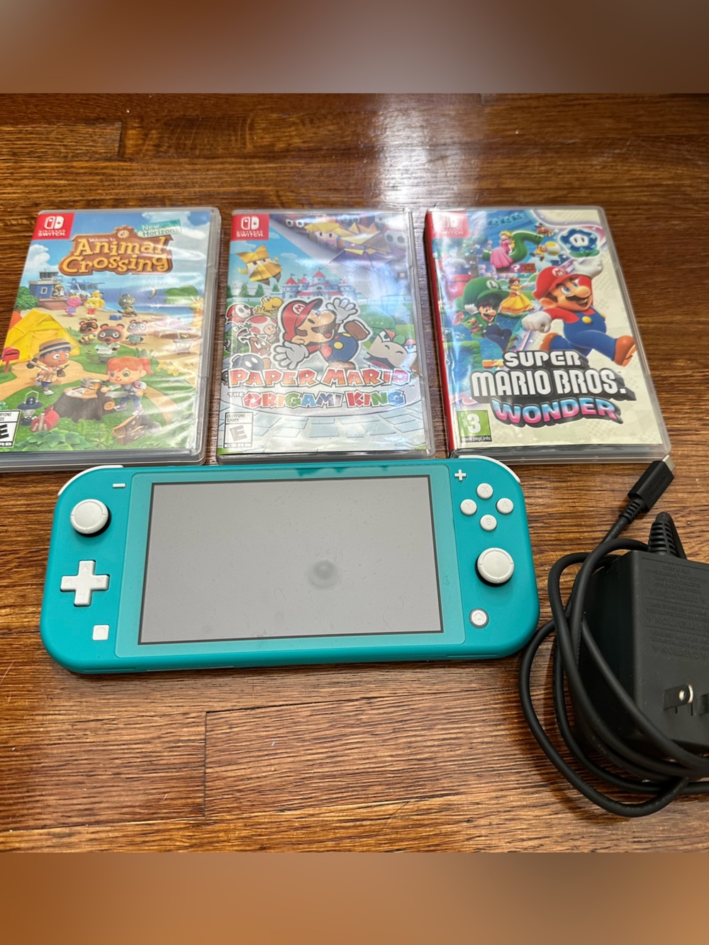 Nintendo Switch Lite (Turquoise) with Charger and 3 Games